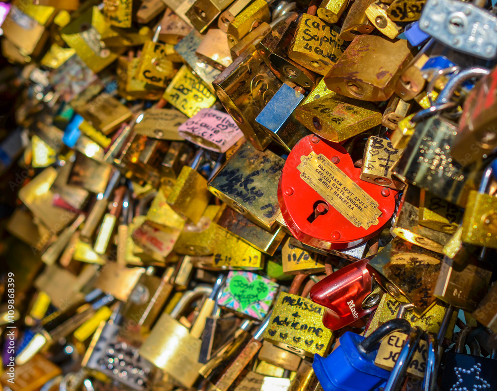 PARIS - APRIL 17: Love Padlocks at Pont des Arts on April 17, 2014, in Paris, France. Lots of colorful locks on a bridge symbolize love forever.