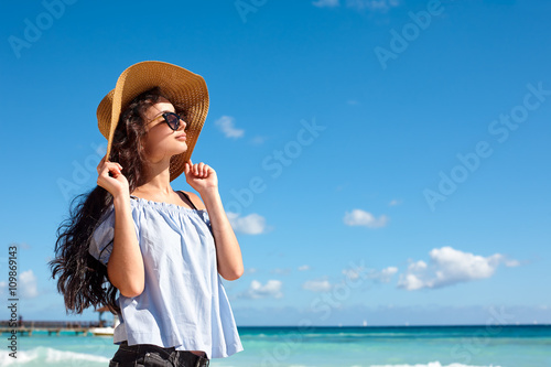 Woman in sunhat on a beach