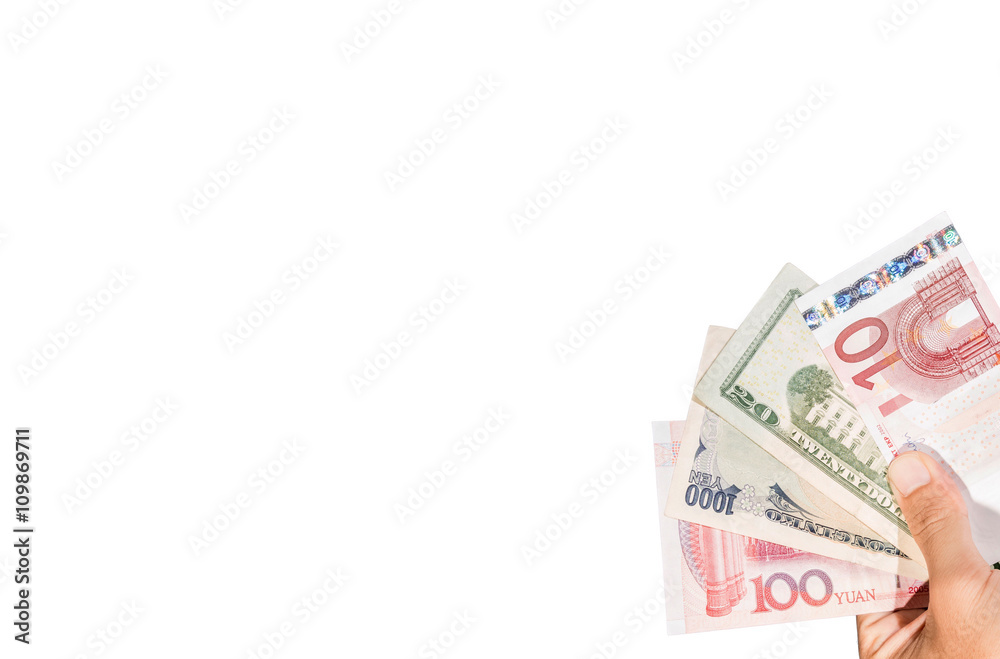 Ten euro banknote on hand with other currencies Ten euro banknote on hand with other currencies