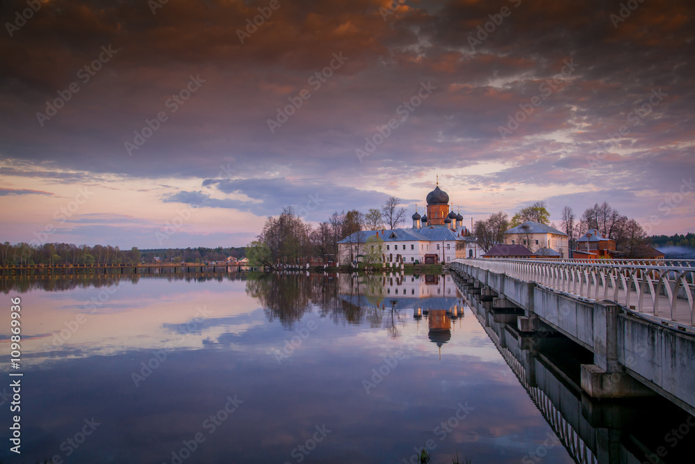Beautiful landscape. Russian Orthodox church at sunset. The arch