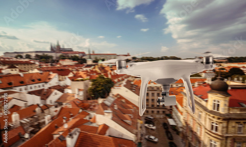 Canvas Print Drone quad copter photographs and records Prague tourist city center
