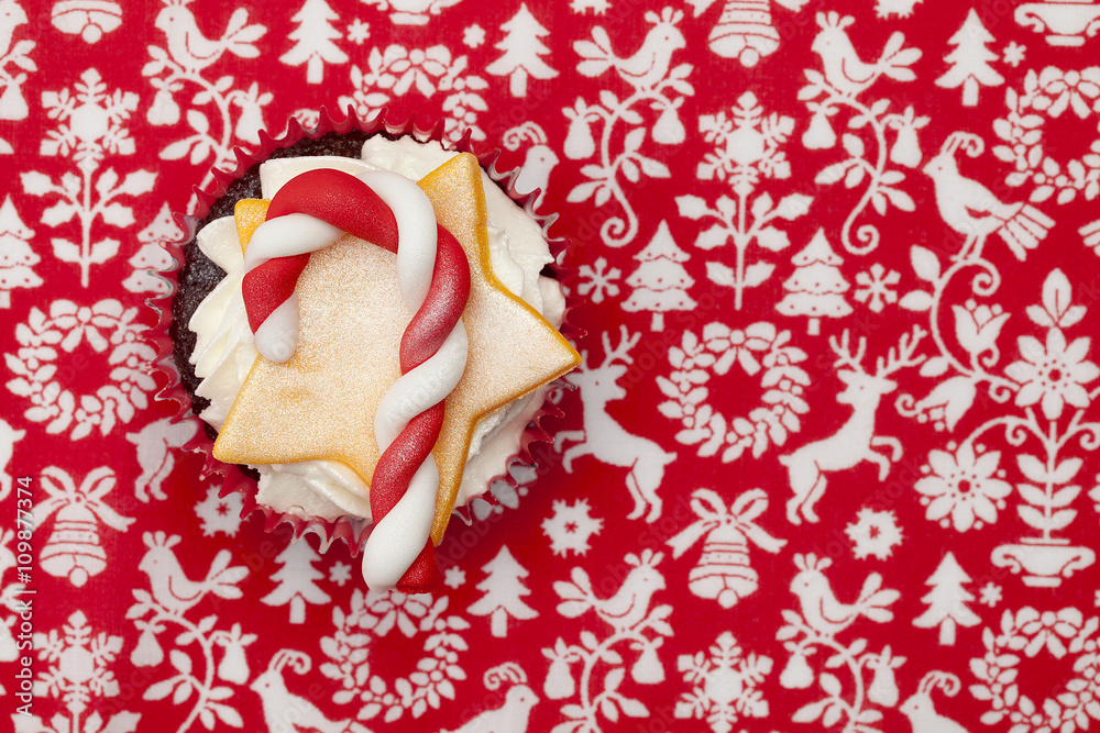 cupcake with candy cane and star shape.