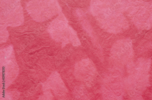 red painted crepe paper background