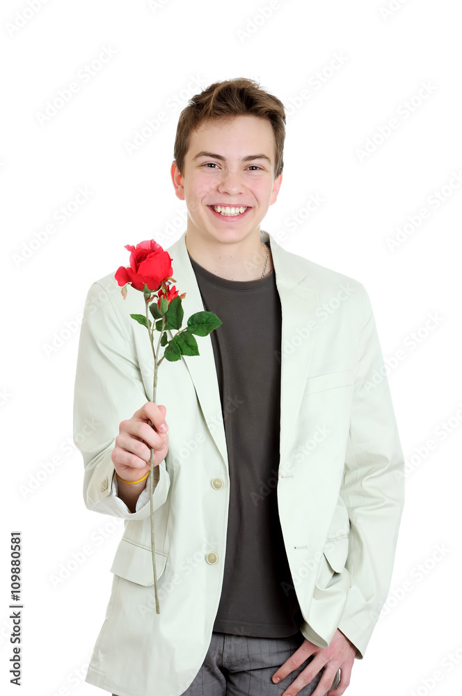 Valentines day. Portrait of young man holding the rose over the white background Valentines day. Portrait of young man holding the rose over the white background