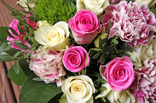 roses and carnation bouquet in pink and white