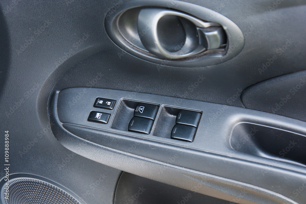 Button in car for adjust windows and lock the door.