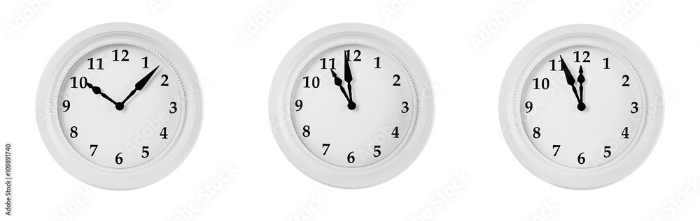Collage of round wall clocks, isolated on white Collage of round wall clocks, isolated on white