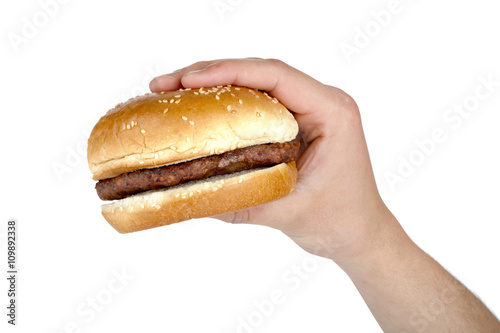 human's hand with hamburger