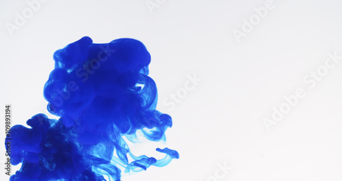 blue ink spreading in water, 4k photo