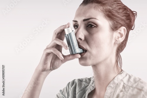 Composite image of portrait of a asthmatic woman 