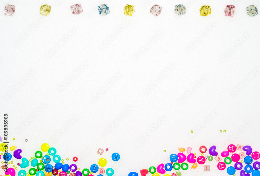 Background with plastic fake jewels on white background
Background with plastic fake jewels on white background
