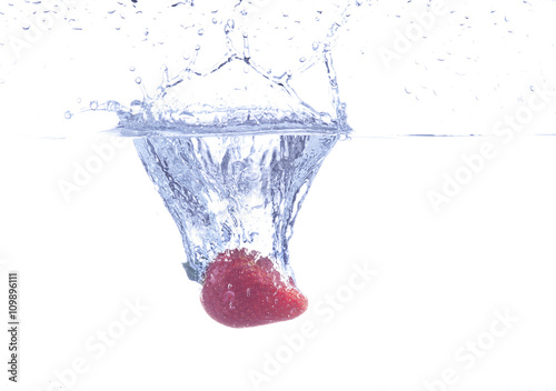 strawberry falling on water