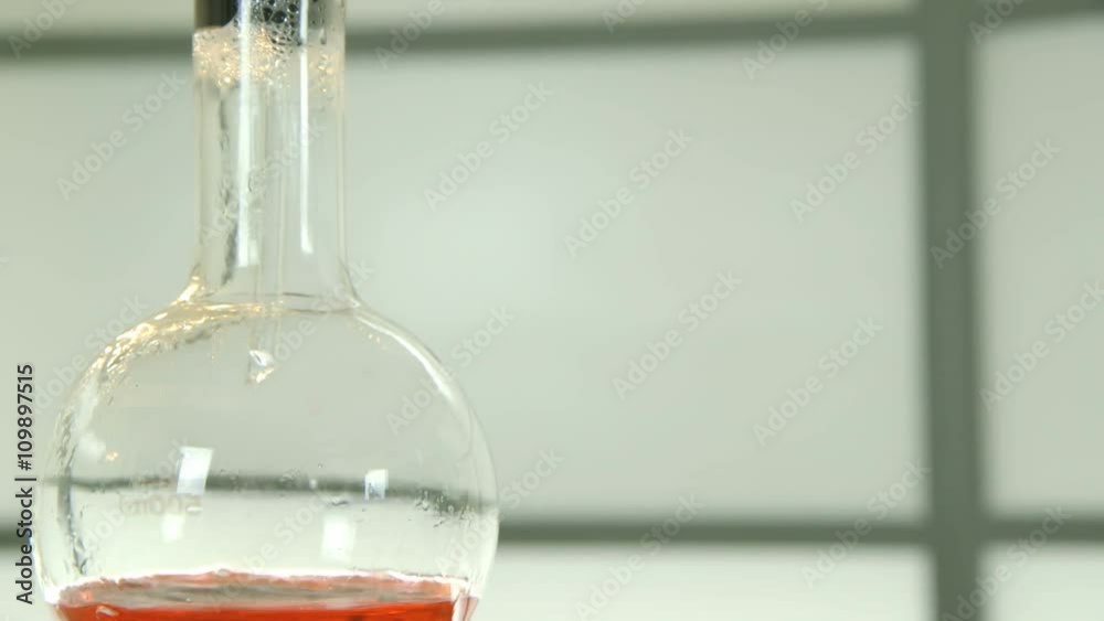 Action moves down past a distillation bulb to boiling liquid in the flask it is attached to.