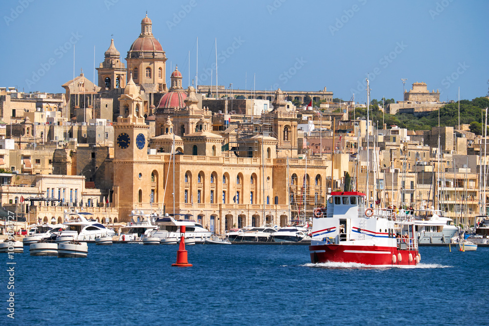 The ship  passes the bay along the Birgu coast, Malta.