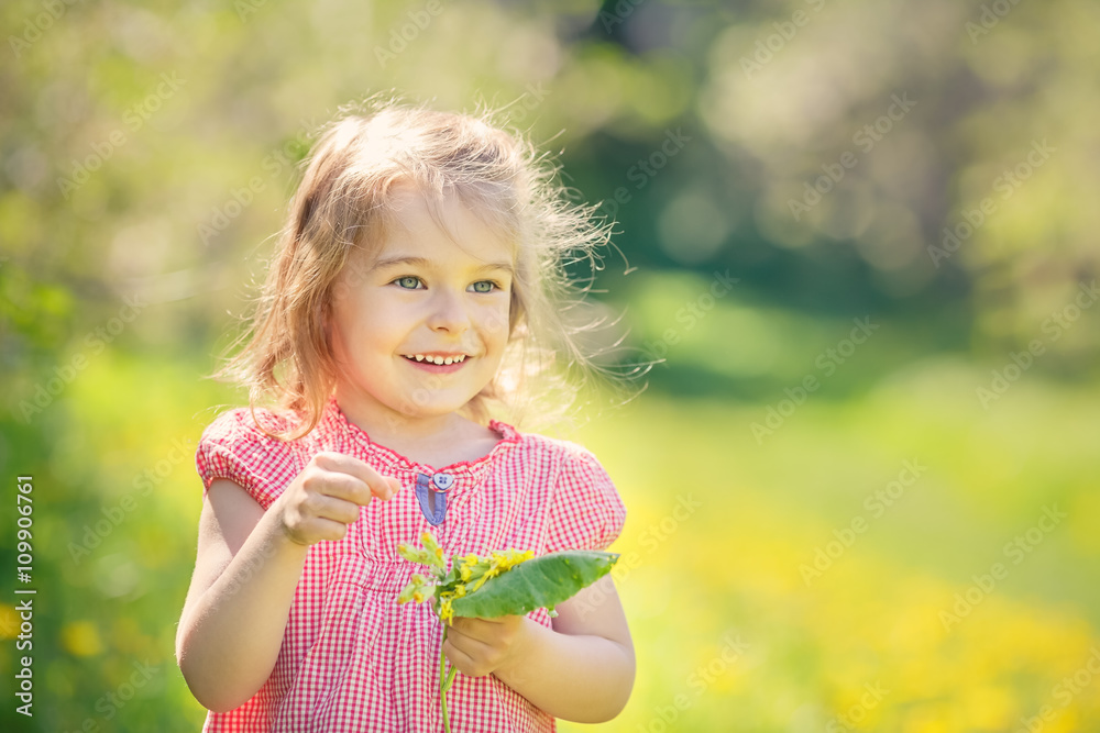 Happy little girl playing in sunny park Happy little girl playing in sunny park