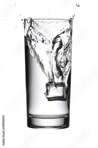 ice cube in water glass.