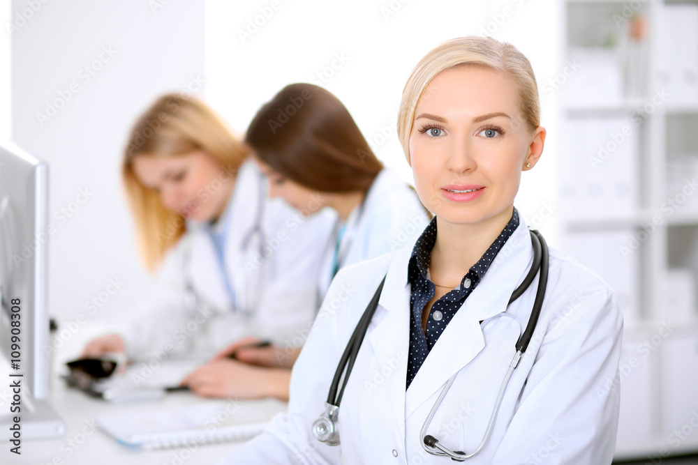 Female doctor leading a medical team at the hospital Female doctor leading a medical team at the hospital