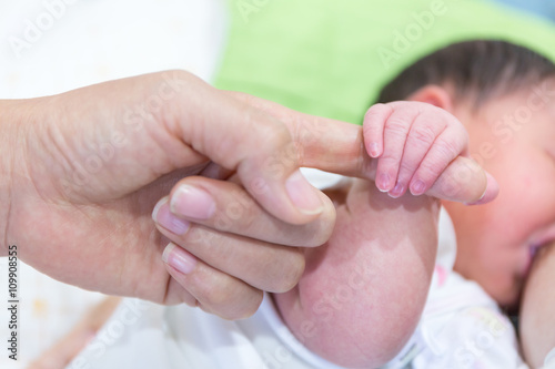 Closeup hands of mother and baby. photo