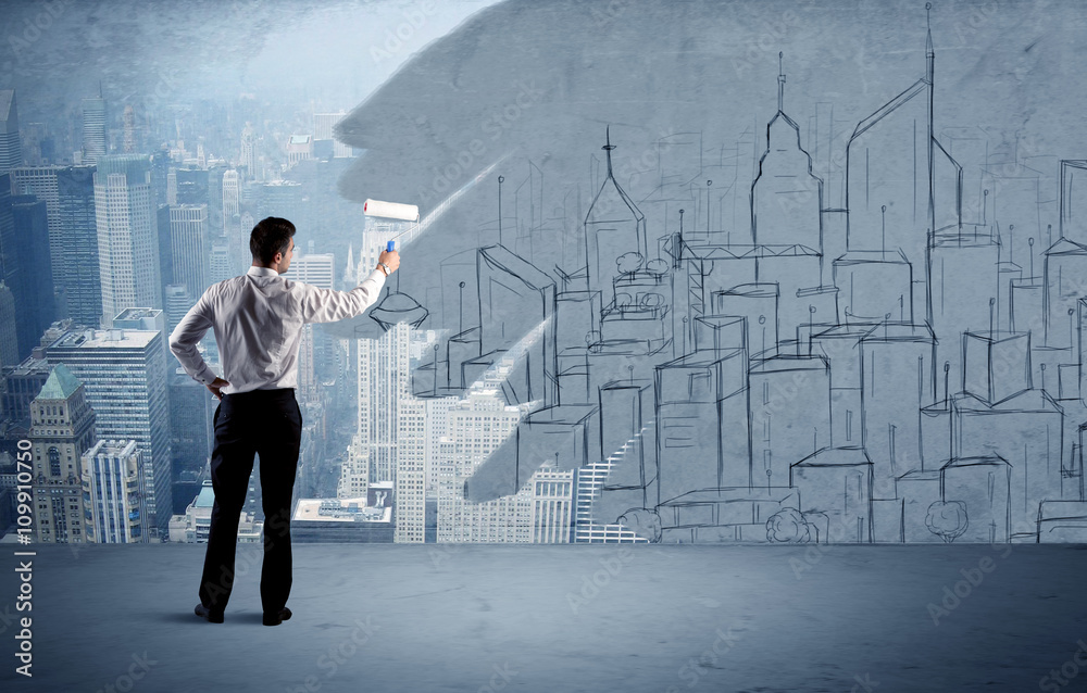 Elegant salesman repainting the city on wall Elegant salesman repainting the city on wall