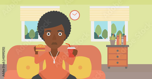 Woman eating hamburger. 