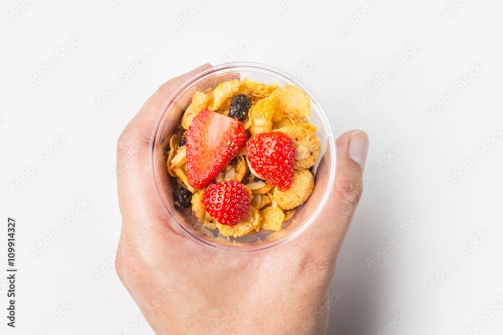Hand hold Chia Pudding with Strawberry, top view Hand hold Chia Pudding with Strawberry, top view