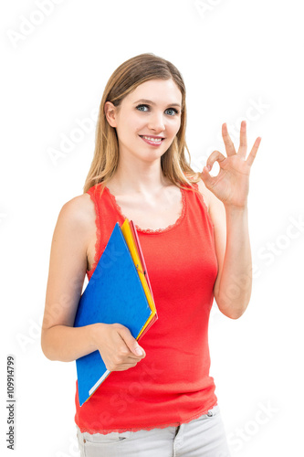 smiling woman with OK gesture and folder on white background