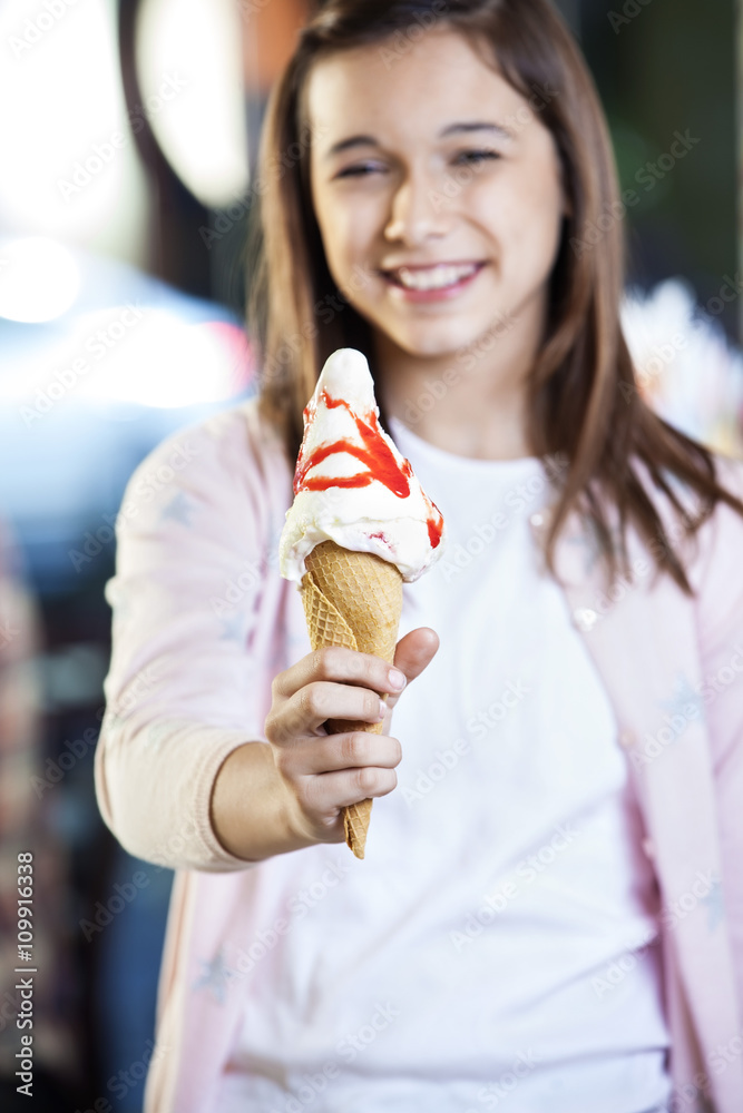 Girl Showing Tasty Ice Cream With Strawberry Syrup