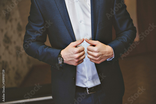 purple satin tie with black tux. Closeup