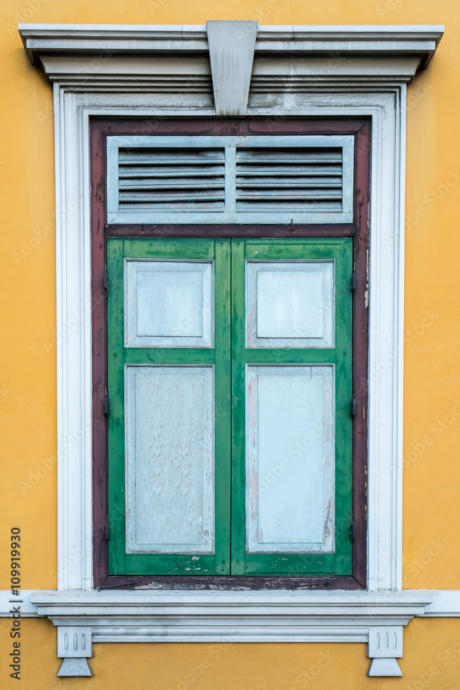 Green window on a yellow wall (Portugese style window)