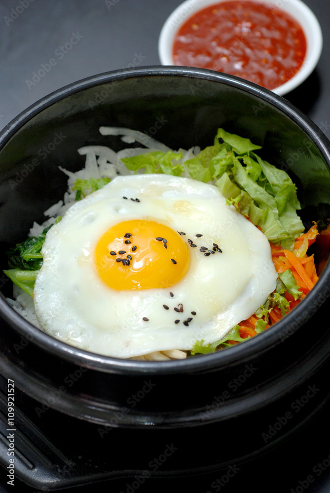 Rice with vegetable in hot bowl Korean food