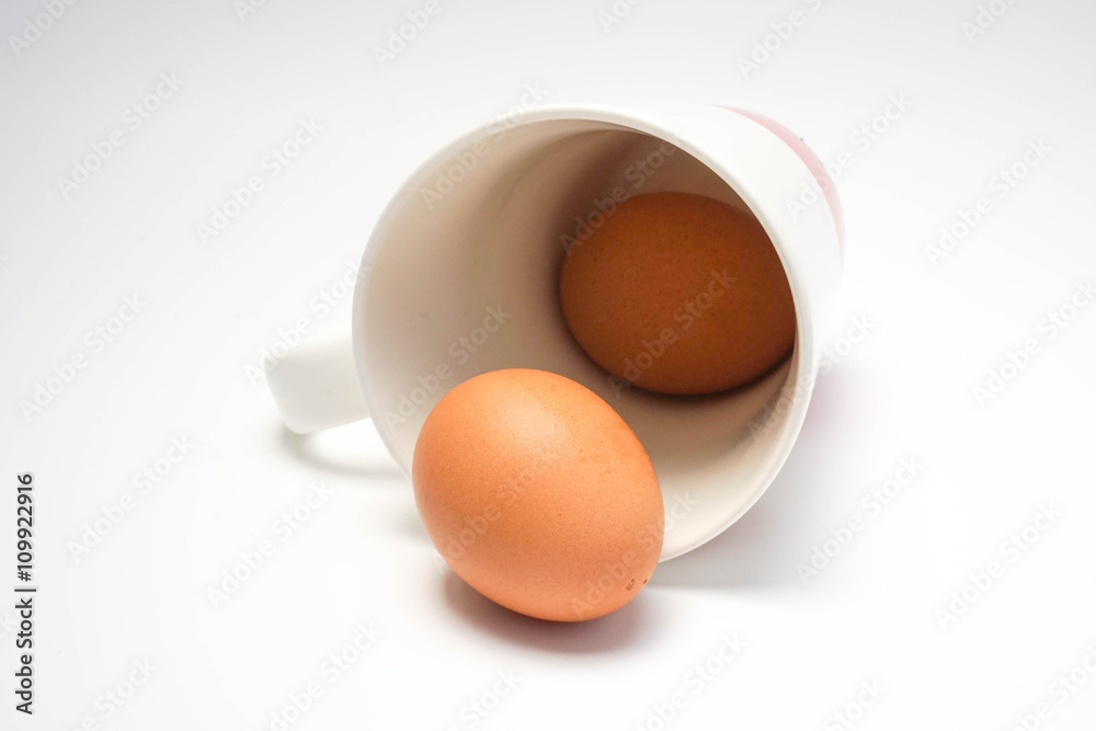 Coffee cup with eggs in white background Coffee cup with eggs in white background