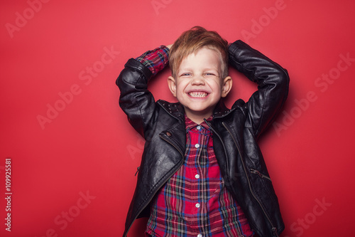 Billede på lærred Fashion little boy wearing a leather jacket
