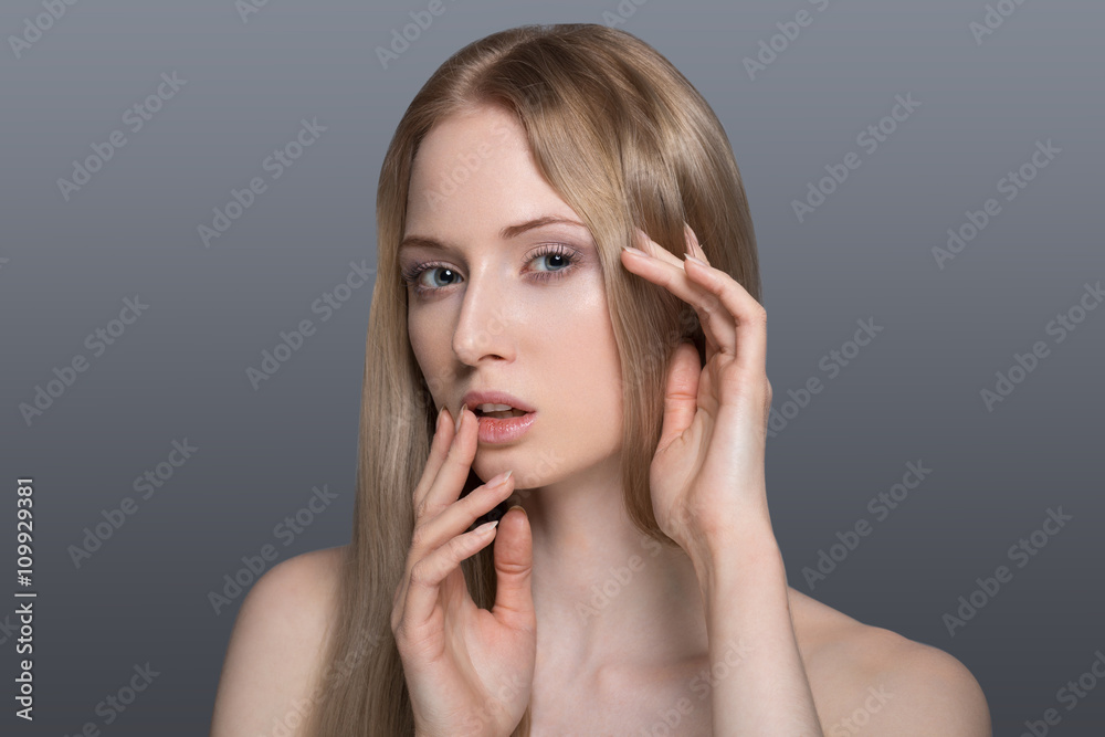 Beauty young blonde woman on gray background isolated Beauty young blonde woman on gray background isolated