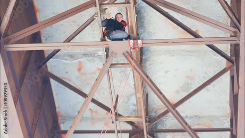 climber working on the bridge - mounted system for jumping photo