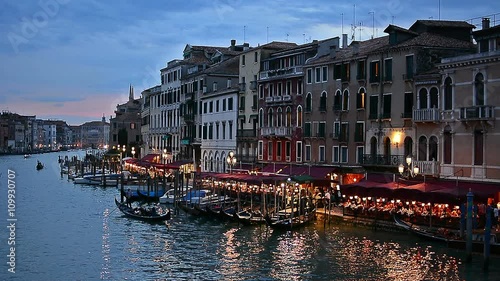 The famous Grand Canale as seen from Rialto Bridge at blue hour in Venice, Italy. Rack focus at the beginning of the shot.