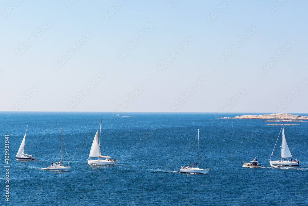 Sailboats sailing in a sea lane in the sea