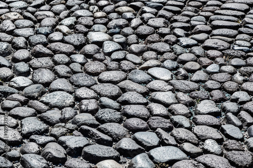 Italy: ancient stone road pavement.