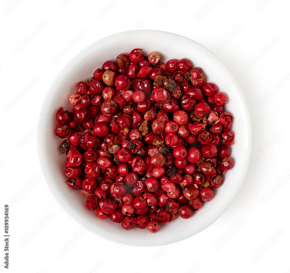 Bowl of red peppercorn isolated on white, top view Bowl of red peppercorn isolated on white, top view