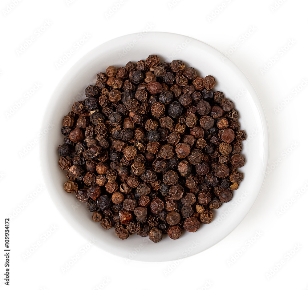 Bowl of black pepper isolated on white, top view Bowl of black pepper isolated on white, top view