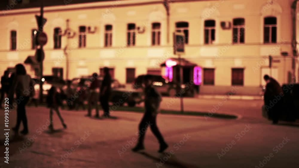 Man chase a boy. Urban night scene, Defocused. Toned shot Man chase a boy. Urban night scene, Defocused. Toned shot