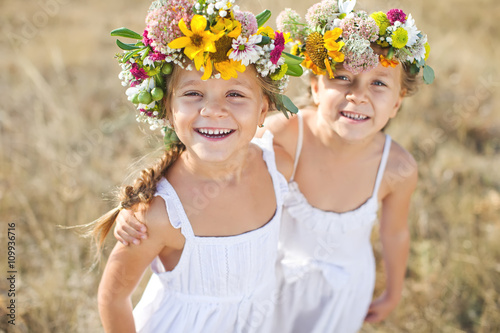Kids with flower bunch on nature 