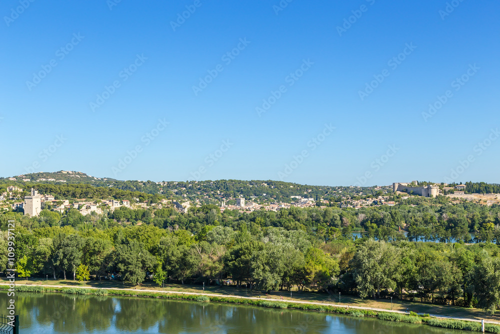 Avignon, France. Landscape with the island on the Rhone River. In the background the city of Villeneuve-lès-Avignon and Fort Saint-André (right)