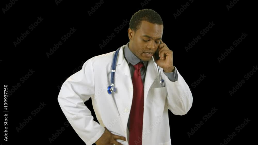A young African American doctor talking on his cell phone. With Alpha Channel for easy import of your own background. No keying out needed. A young African American doctor talking on his cell phone. With Alpha Channel for easy import of your own background. No keying out needed.