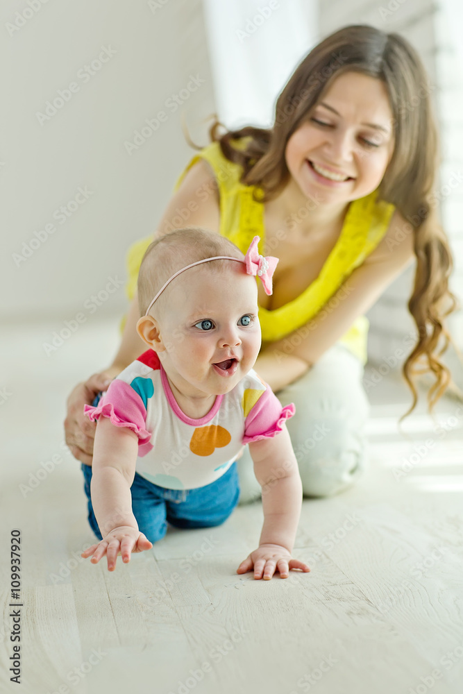 Mother play with baby in studio Mother play with baby in studio