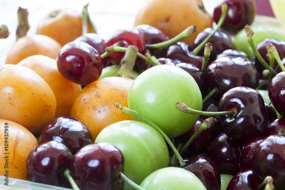 summer fruit. Loquat-medlar, cherry, plum summer fruit. Loquat-medlar, cherry, plum