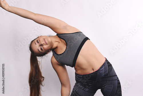 Athlete young woman doing exercise.