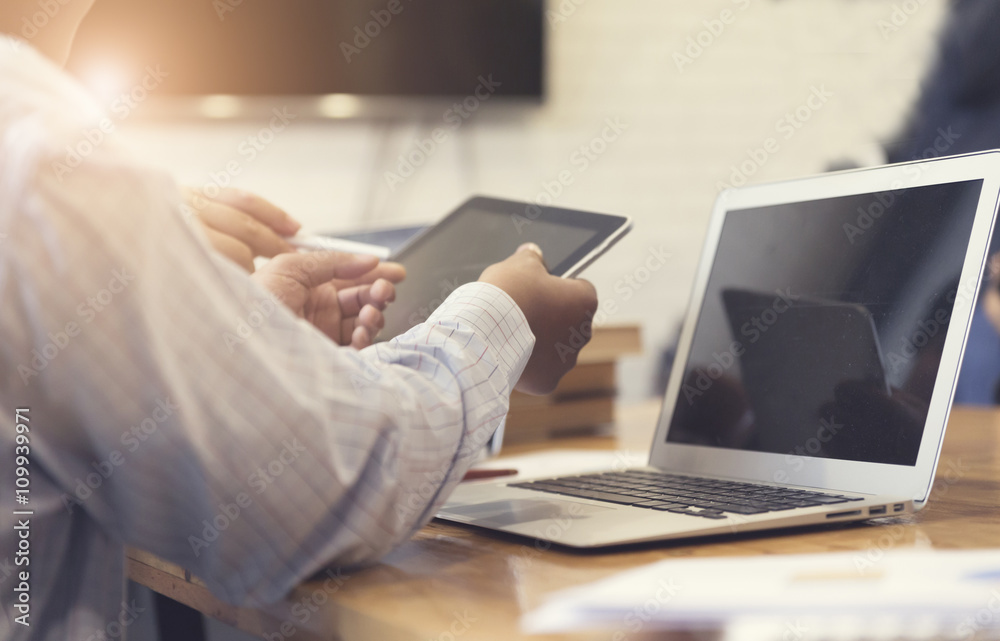 man's hand working with tablet, document and laptop computer not man's hand working with tablet, document and laptop computer not