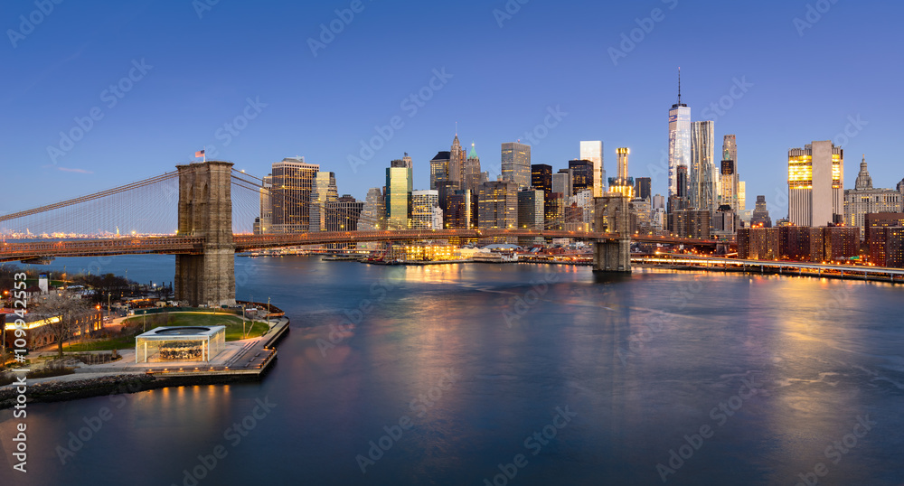 Aerial view of the Brooklyn Bridge at sunrise and Manhattan Lower East Side Financial District. New York City