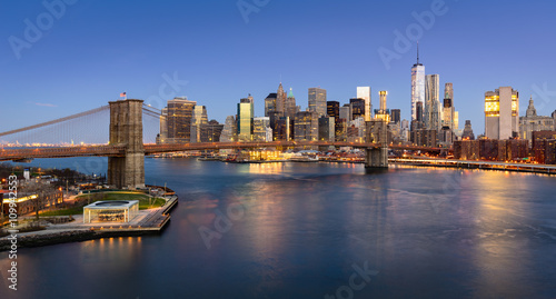 Aerial view of the Brooklyn Bridge at sunrise and Manhattan Lower East Side Financial District. New York City