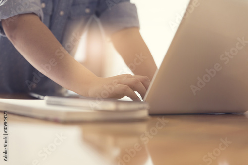 woman's hand working with laptop computer